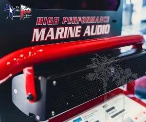 Red marine audio equipment with skull graphic on display.